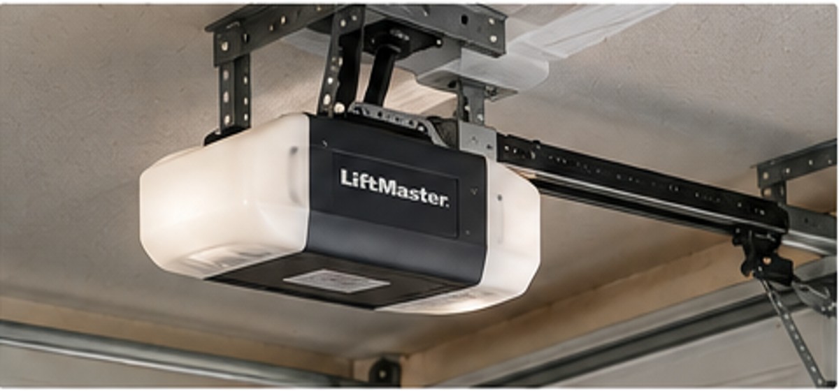 Ceiling-mounted garage door opener being evaluated for repair or replacement