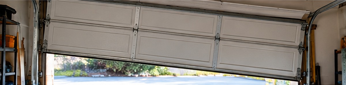 Garage Door Off Track: Causes, Warning Signs & Safe Response